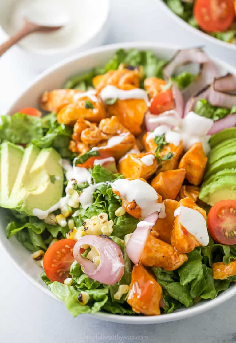 Buffalo chicken salad with Ranch dressing in a bowl.