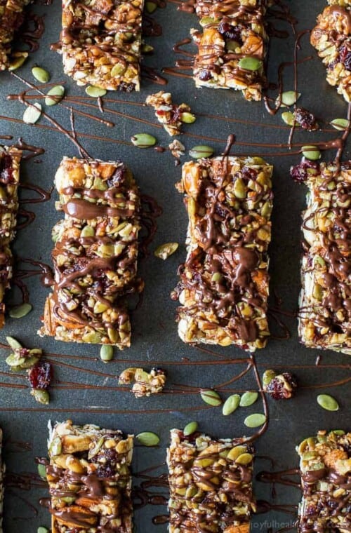 Easy Gluten Free Cranberry Almond Homemade Granola Bars - loaded with nuts, cranberries and a chocolate drizzle for good measure. These Granola Bars are perfect snack to have on hand at all times!