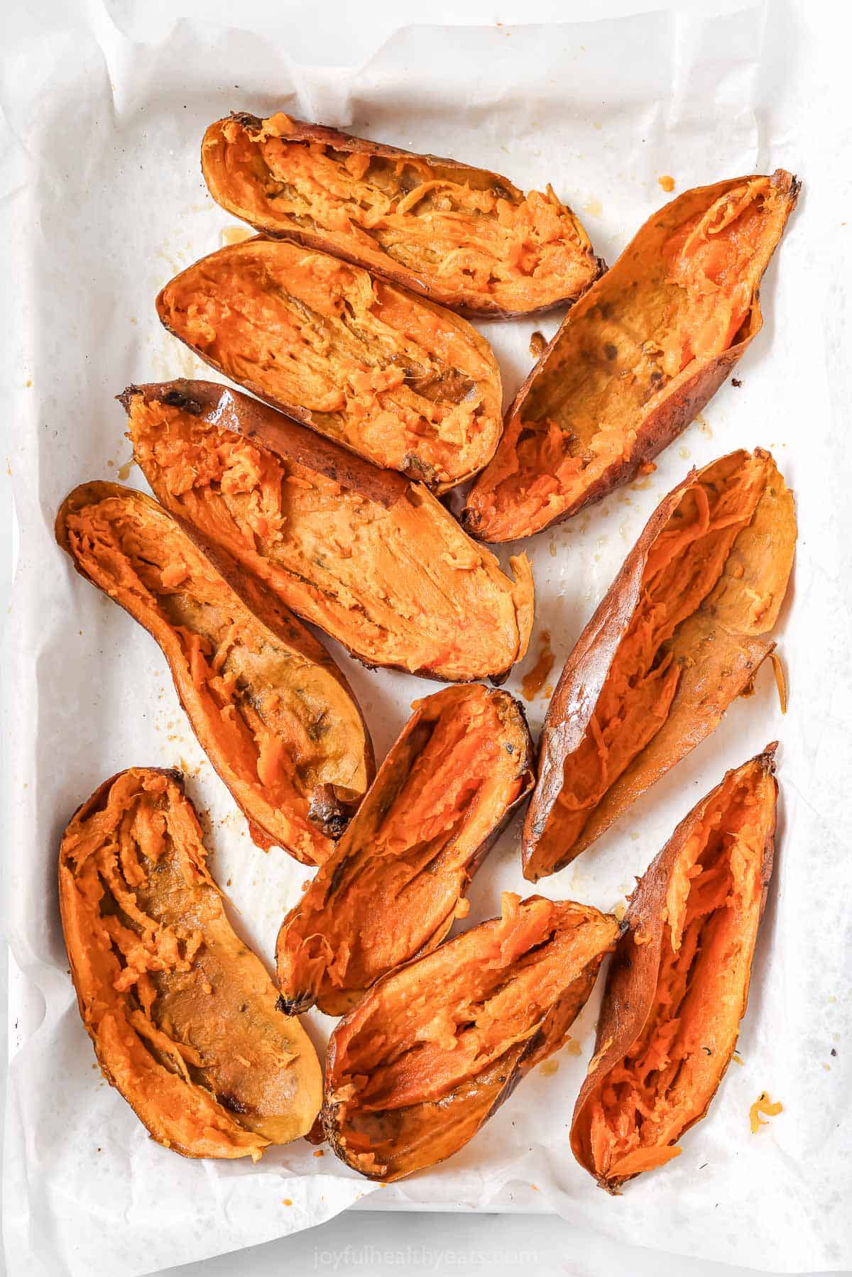 Baked sweet potatoes with the filling scooped out.