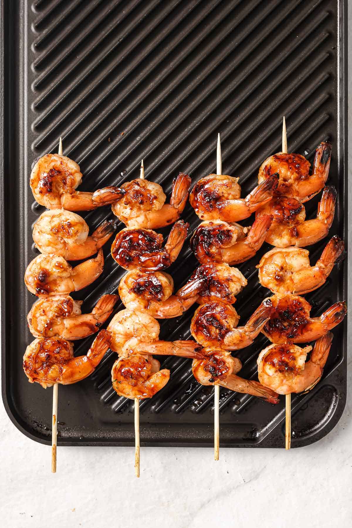 Fried honey garlic shrimp skewers. 