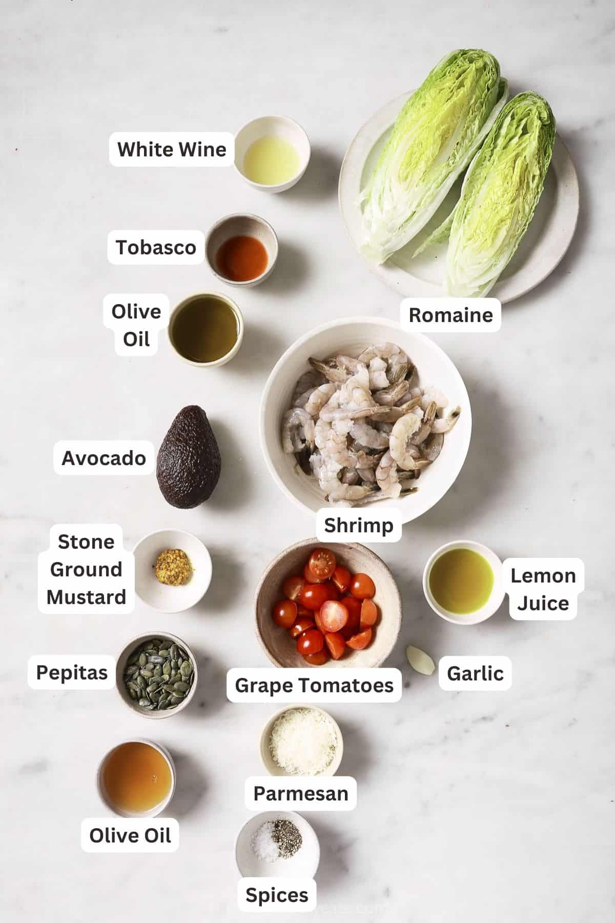 Labeled ingredients for shrimp caesar salad. 