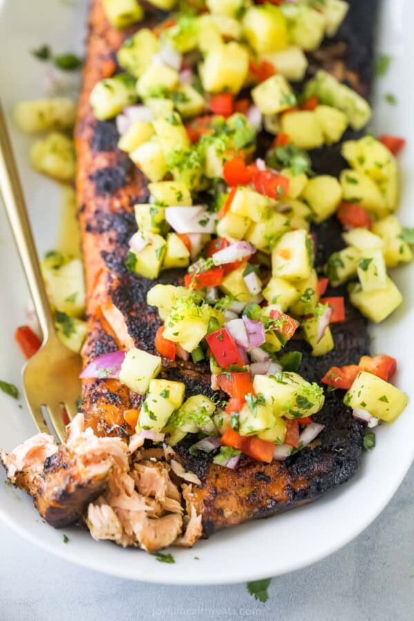 Pinch pieces of flaky salmon with a fork.