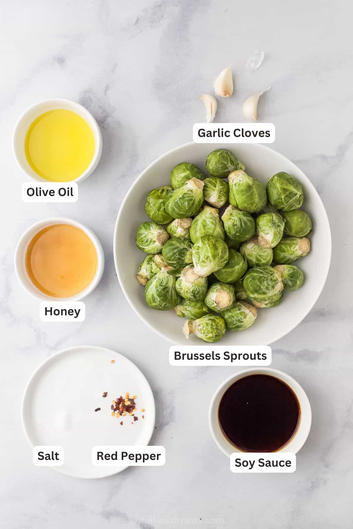 Labeled ingredients for making honey roasted Brussels sprouts. 