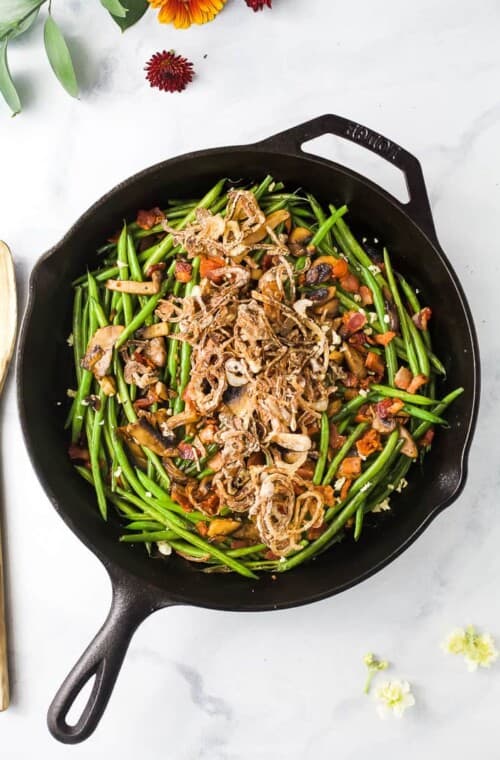 Overhead photo of healthy green bean casserole in a skillet.