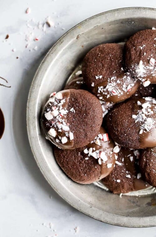 gluten free chocolate cookies sprinkled with peppermint candy in a serving dish