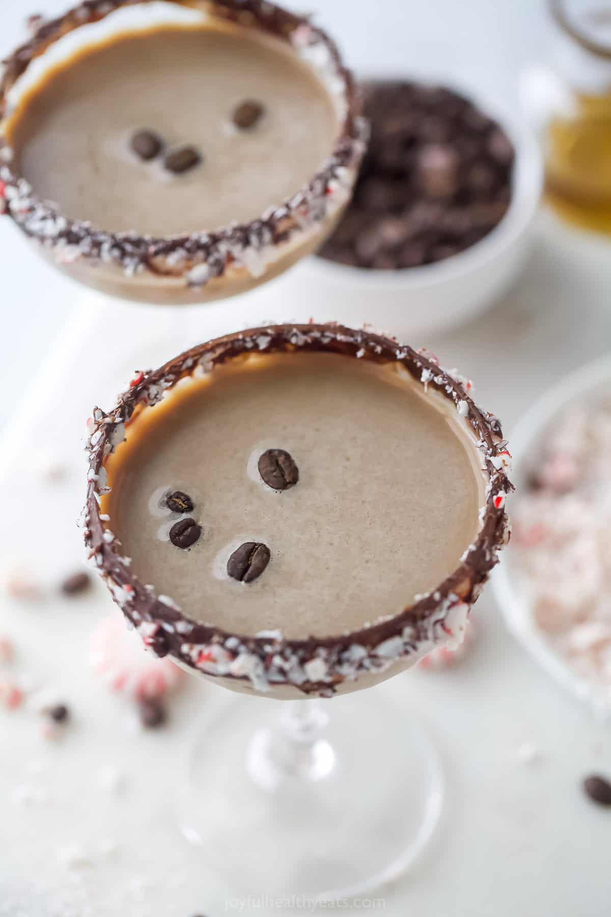 Overhead photo of two creamy cocktails garnished with coffee beans.