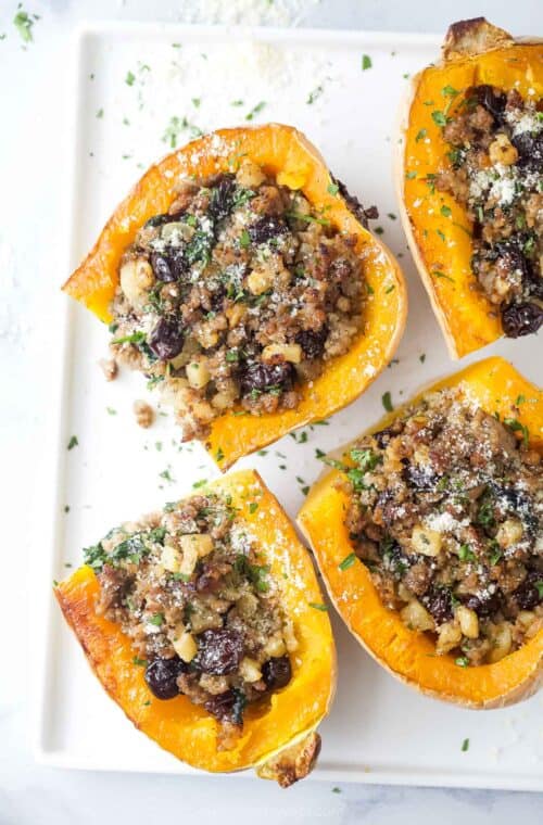 Halved butternut squashes with homemade sweet-and-savory sausage-apple filling.