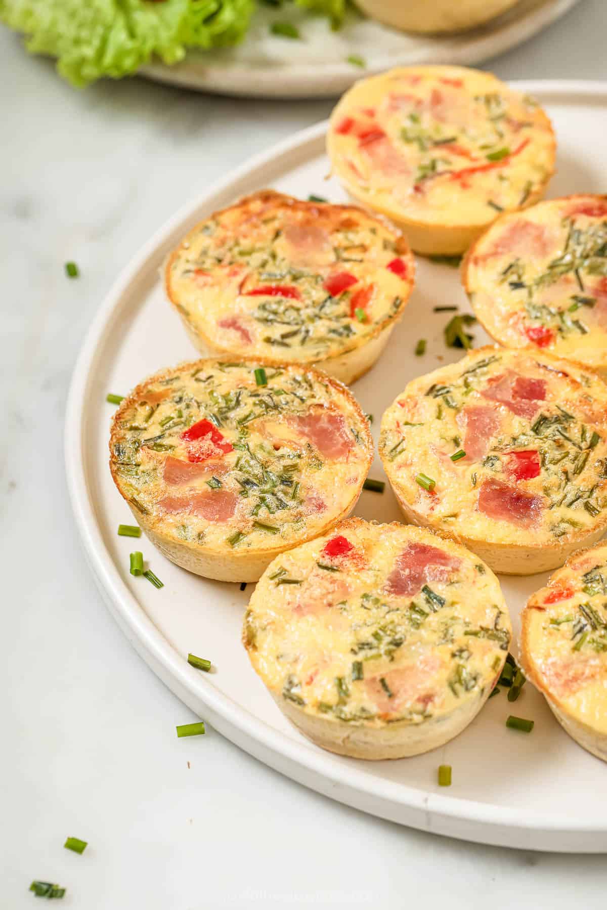 Tender egg bites with ham and roasted red peppers. 