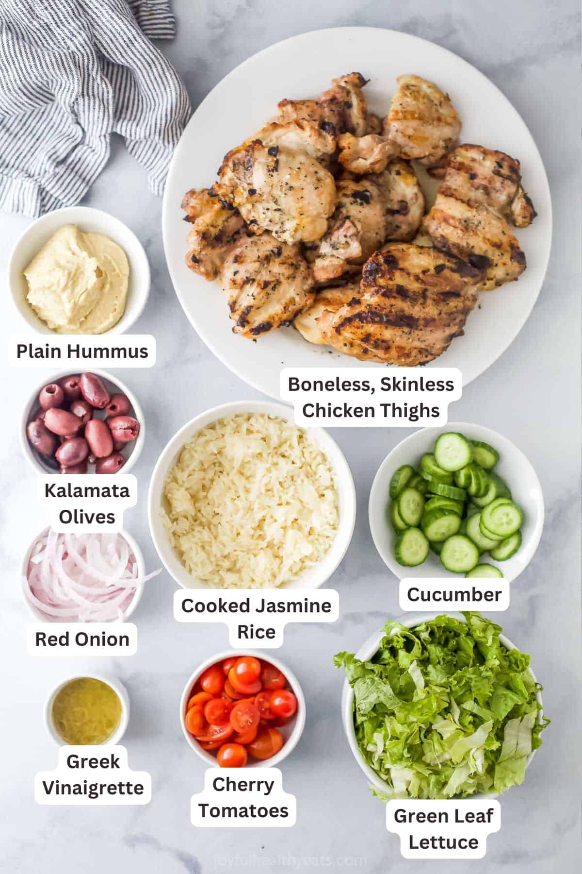 Labeled ingredients for making Greek chicken bowls. 