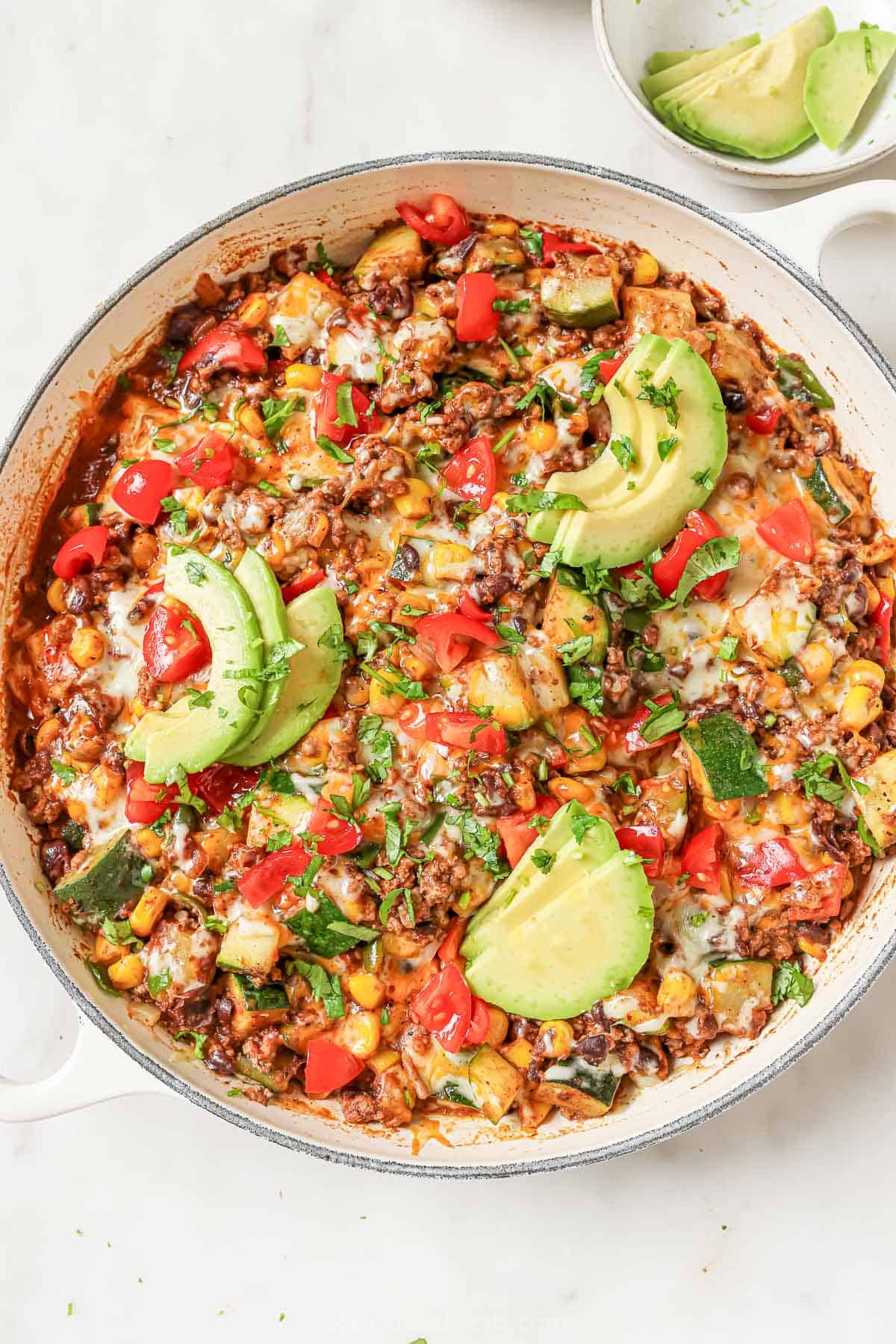 A whole skillet filled with Tex-Mex ground beef and zucchini. 