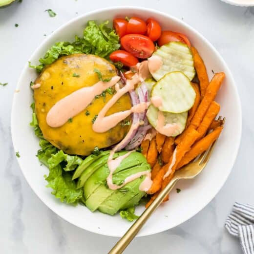 Assembled burger bowl recipe with special mayo-ketchup sauce drizzled on top.