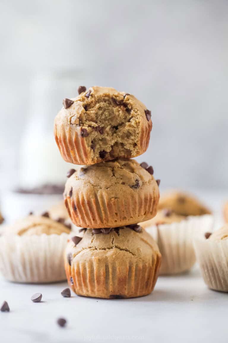 A stack of three vanilla protein muffins with chocolate chips.