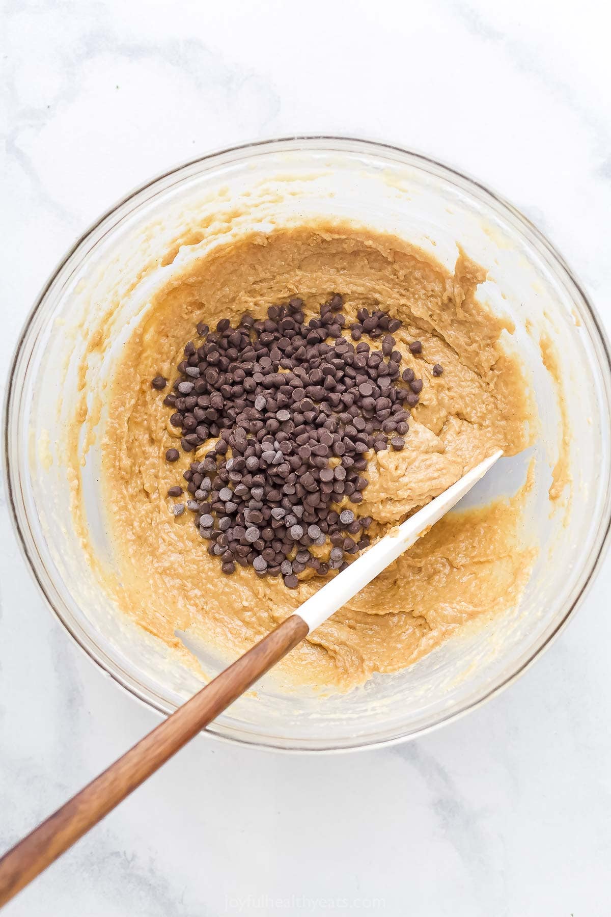 Folding the chocolate chips into the batter. 