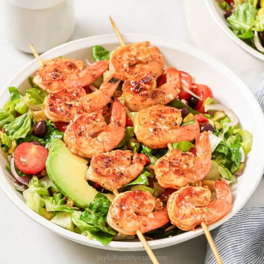 Landscape photo of grilled shrimp salad.