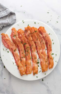 Baked bacon on a serving plate.