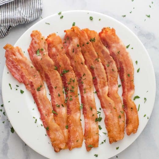 Baked bacon on a serving plate.